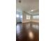 Beautiful and bright living room featuring hardwood floors and neutral paint at 331 N Dollins Ave, Orlando, FL 32805