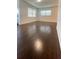 Bright living room with beautiful hardwood flooring and neutral paint at 331 N Dollins Ave, Orlando, FL 32805