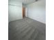 Spacious bedroom with neutral carpet, closet and white walls at 33836 Sky Blossom Cir, Leesburg, FL 34788