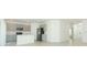 Open-concept kitchen and living area, featuring tile floor and stainless steel appliances at 33836 Sky Blossom Cir, Leesburg, FL 34788