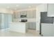 Bright kitchen with stainless steel appliances and island at 33836 Sky Blossom Cir, Leesburg, FL 34788
