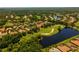 A sprawling community with lush landscaping, lakes, and golf course views at 3512 Legacy Hills Ct, Longwood, FL 32779