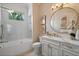 Beautiful bathroom with marble tile, gold fixtures, and natural light at 3512 Legacy Hills Ct, Longwood, FL 32779