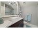 Sleek bathroom featuring a modern sink, stylish wallpaper, and elegant fixtures for a spa-like experience at 3512 Legacy Hills Ct, Longwood, FL 32779