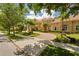 Beautiful Mediterranean style estate home with lush landscaping, mature trees, and a circular brick paved driveway at 3512 Legacy Hills Ct, Longwood, FL 32779