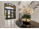 Elegant foyer with a curved staircase and large windows at 3512 Legacy Hills Ct, Longwood, FL 32779