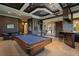 Spacious game room featuring a billiard table, a wet bar, and a TV, creating an ideal entertainment zone at 3512 Legacy Hills Ct, Longwood, FL 32779