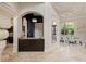 Hallway showing arched doorways, decorative ceilings, and access to the dining and kitchen areas at 3512 Legacy Hills Ct, Longwood, FL 32779