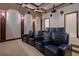 A spacious home theater with comfortable seating and a projector at 3512 Legacy Hills Ct, Longwood, FL 32779