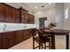 Cozy eat-in kitchen with dark wood cabinetry and breakfast nook at 3512 Legacy Hills Ct, Longwood, FL 32779