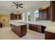 Spacious kitchen boasting custom cabinetry, stone countertops, and a large center island at 3512 Legacy Hills Ct, Longwood, FL 32779