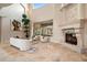 Bright living room featuring travertine floors, fireplace, and a view of the pool at 3512 Legacy Hills Ct, Longwood, FL 32779