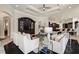 Inviting living room with dark wood floors, comfortable seating, and access to the kitchen area at 3512 Legacy Hills Ct, Longwood, FL 32779