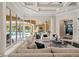 Bright living room with large sliding doors leading to an outdoor pool and patio area at 3512 Legacy Hills Ct, Longwood, FL 32779