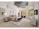 Main bedroom with decorative ceiling, seating area, and access to the pool at 3512 Legacy Hills Ct, Longwood, FL 32779