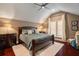 Comfortable main bedroom with hardwood floors, plush rug, and a ceiling fan for a relaxing ambiance at 3512 Legacy Hills Ct, Longwood, FL 32779