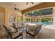 Covered patio with pool view and tile roof at 3512 Legacy Hills Ct, Longwood, FL 32779
