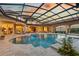 The screened pool and spa offer a private outdoor retreat, complete with fountains and ample patio space at 3512 Legacy Hills Ct, Longwood, FL 32779