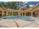 The backyard features a screened pool with a spa, providing a serene oasis for relaxation and entertainment at 3512 Legacy Hills Ct, Longwood, FL 32779