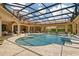 Resort-style pool and spa area with covered lanai, ideal for outdoor living and entertaining in a private setting at 3512 Legacy Hills Ct, Longwood, FL 32779