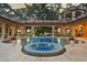A luxurious pool with a screened enclosure offers a spa and plenty of space for outdoor entertaining at 3512 Legacy Hills Ct, Longwood, FL 32779