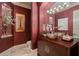 Stylish powder room with unique sink, ornate mirror, and decorative accents, perfect for guests at 3512 Legacy Hills Ct, Longwood, FL 32779