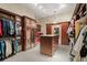 Large walk-in closet with custom storage and organization system at 3512 Legacy Hills Ct, Longwood, FL 32779