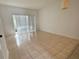 Bedroom with tiled floors and sliding glass doors to the backyard at 3549 Wilshire Way Rd # 56, Orlando, FL 32829