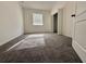 Cozy bedroom with neutral carpet, natural light from window, and access to a closet at 3549 Wilshire Way Rd # 56, Orlando, FL 32829