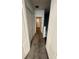Upstairs hallway with carpet, closet, and doorway leading to a bedroom, providing ample storage at 3549 Wilshire Way Rd # 56, Orlando, FL 32829