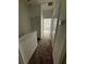 Hallway featuring carpet flooring, closet doors, and view of the carpeted bedroom ahead at 3549 Wilshire Way Rd # 56, Orlando, FL 32829