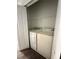Laundry closet equipped with a washer, dryer, and wire shelving for convenient organization and storage at 3549 Wilshire Way Rd # 56, Orlando, FL 32829