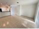Open-concept living room featuring tile flooring and natural light, seamlessly connecting to the kitchen at 3549 Wilshire Way Rd # 56, Orlando, FL 32829