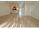 Spacious living room with tile flooring seamlessly connects to the kitchen, creating an open-concept design at 3549 Wilshire Way Rd # 56, Orlando, FL 32829