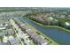 Beautiful aerial view of homes along a canal, surrounded by lush landscaping and a clear blue sky at 4737 Maple Park St, Orlando, FL 32811