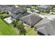 Aerial shot of backyard featuring a well-manicured lawn, patio area, and mature trees for shade at 4737 Maple Park St, Orlando, FL 32811