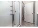 Modern bathroom featuring tiled shower with glass door and chrome fixtures at 4737 Maple Park St, Orlando, FL 32811