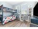 bedroom featuring a bunk bed and desk with lots of natural light at 4737 Maple Park St, Orlando, FL 32811