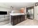 Open concept kitchen with stainless steel appliances overlooking the living room at 4737 Maple Park St, Orlando, FL 32811
