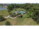 Aerial view of a home with a pool, surrounded by a fenced-in yard and lush landscaping at 5119 Jones Rd, St Cloud, FL 34771