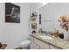 Bathroom featuring a decorative mirror, granite countertops, and stylish decor at 5119 Jones Rd, St Cloud, FL 34771