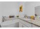 Elegant bathroom with a soaking tub, granite countertops, and stylish fixtures at 5119 Jones Rd, St Cloud, FL 34771