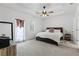 Comfortable bedroom with natural light, ceiling fan, and neutral carpet at 5119 Jones Rd, St Cloud, FL 34771