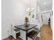 Charming dining area with a built-in bench and unique wooden table and flooring at 5119 Jones Rd, St Cloud, FL 34771