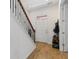 Inviting entryway with a staircase and coat rack, featuring light hardwood flooring at 5119 Jones Rd, St Cloud, FL 34771