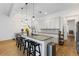 Bright kitchen with a large island, granite countertops, and modern appliances at 5119 Jones Rd, St Cloud, FL 34771