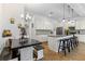 Open kitchen featuring an island with bar stools and a cozy dining nook at 5119 Jones Rd, St Cloud, FL 34771