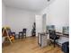 Office space with wood floors and two computer monitors, plus an easel for creative endeavors at 5119 Jones Rd, St Cloud, FL 34771