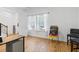 Bright room with wood floors, an easel, and natural light from the large double window at 5119 Jones Rd, St Cloud, FL 34771