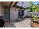 This covered brick patio has seating, a grill and a door leading into the home at 5119 Jones Rd, St Cloud, FL 34771